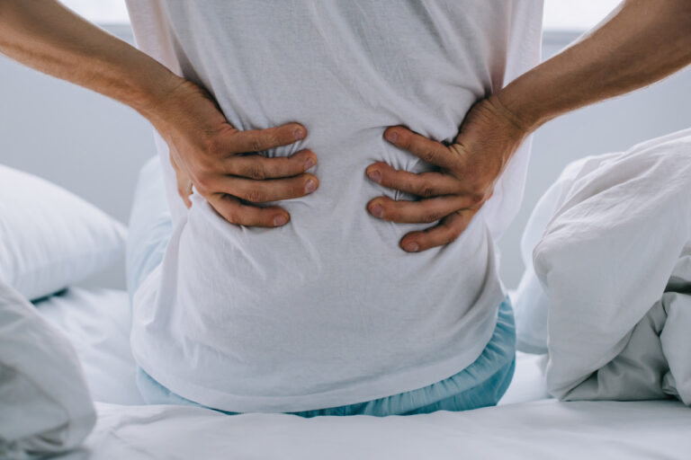 cropped-shot-of-man-sitting-on-bed-and-suffering-f-2021-08-29-22-50-57-utc_Easy-Resize.com